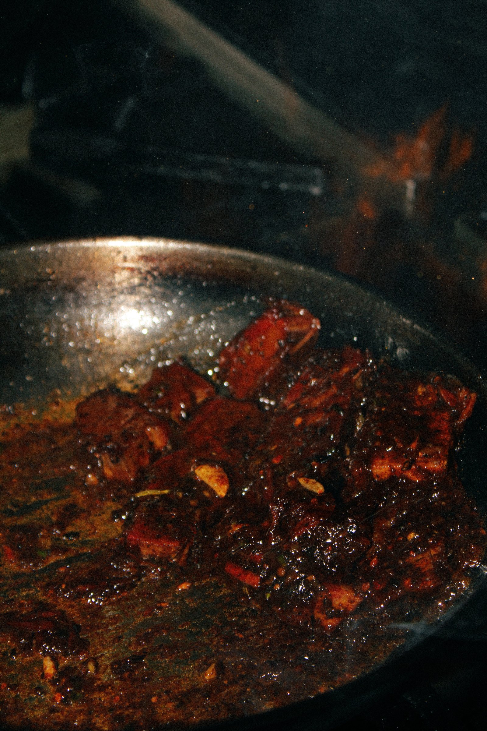 Smoked meat glazing in a pan on the stove