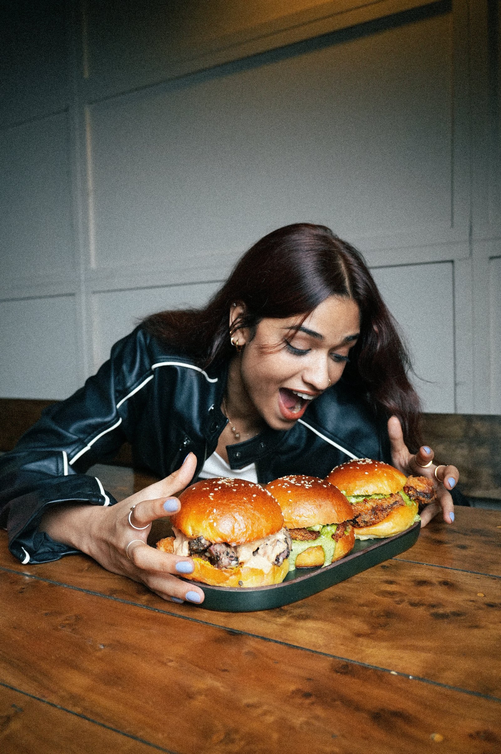Guests gathered around smoked sliders at PuKa